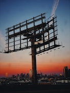 a large metal structure with scaffolding on top of it