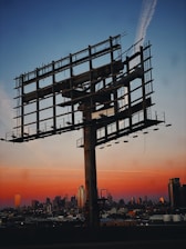 a large metal structure with scaffolding on top of it