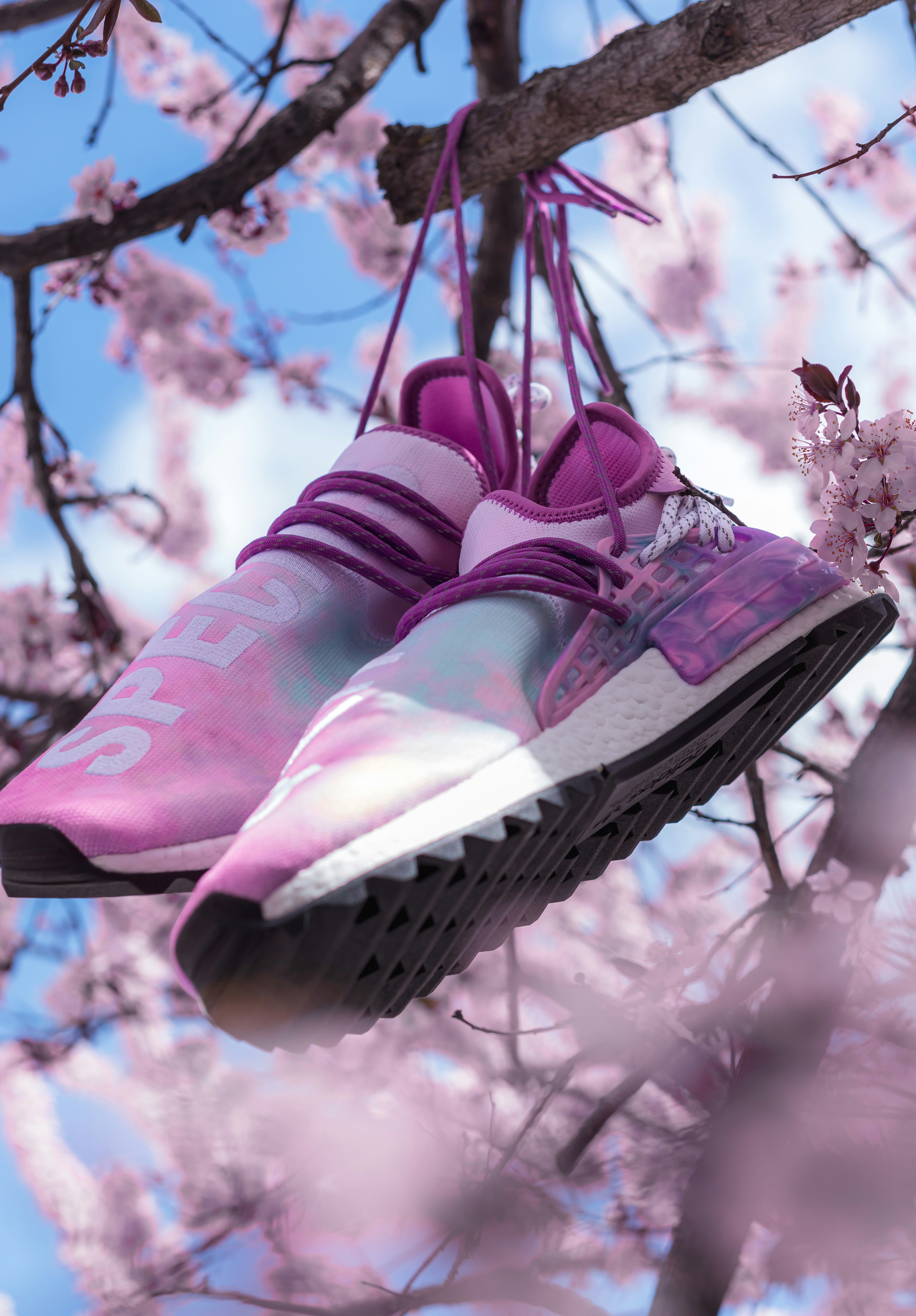  Close-up shots of sneakers made from sustainable materials, such as recycled plastic and organic cotton, with emphasis on texture and eco-friendly labels. 