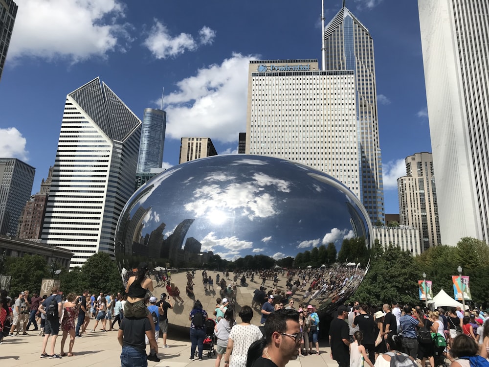 people walking on park near cloud gate during daytime