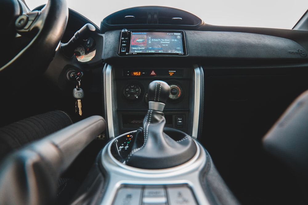 black and silver car gear shift lever