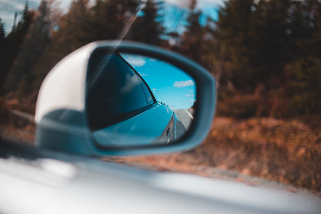 car side mirror with water droplets