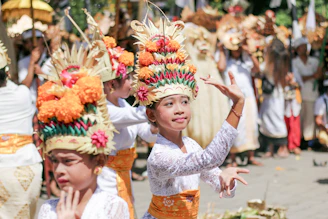 woman in white lace dress with yellow and red flower headdress
