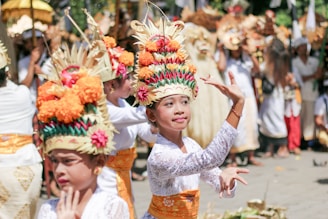 woman in white lace dress with yellow and red flower headdress