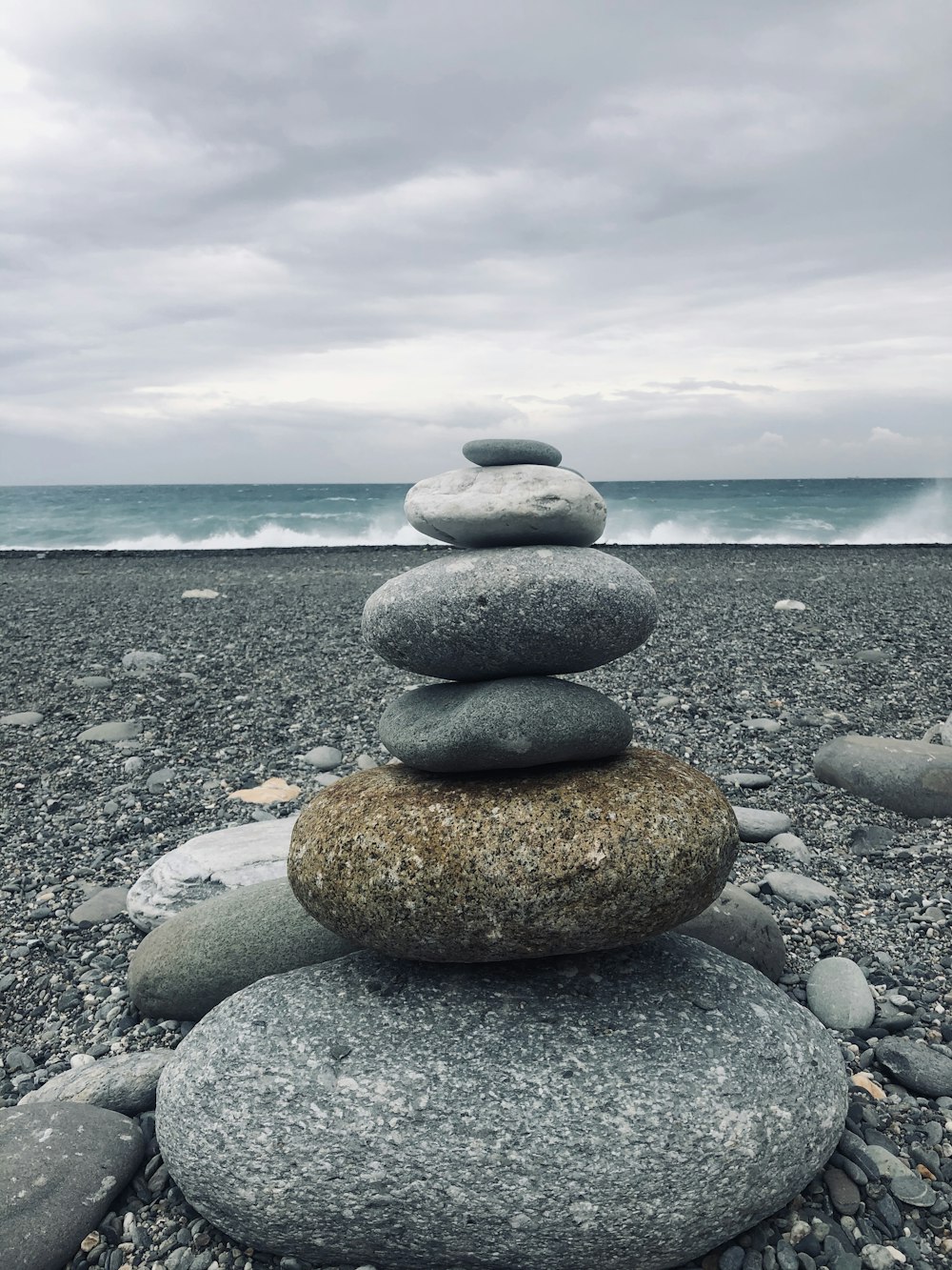 brown and gray stone on gray rocky shore during daytime