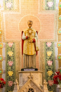 woman in red and gold dress figurine