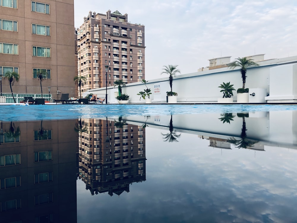 brown concrete building near body of water during daytime