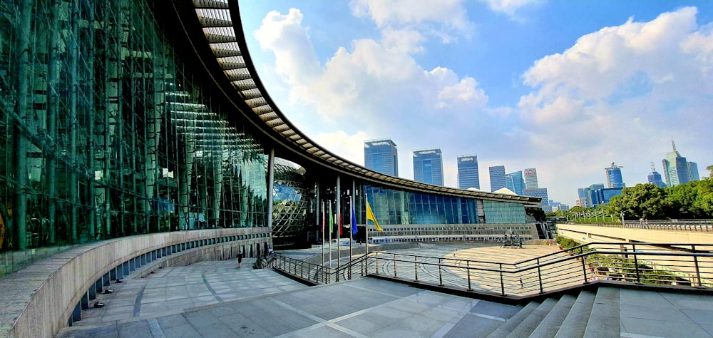 people walking on bridge near city buildings during daytime