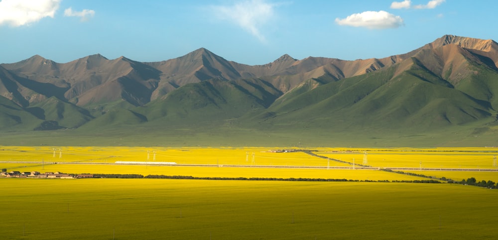 green and brown mountains under blue sky during daytime