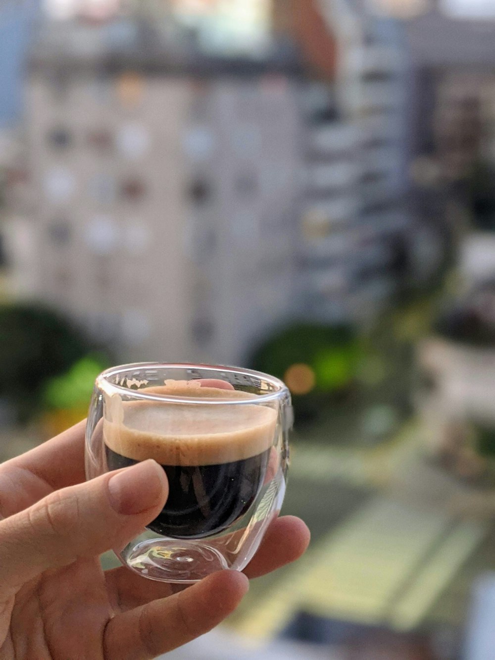 clear glass cup with brown liquid