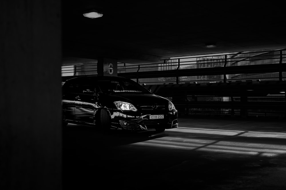 grayscale photo of cars on road