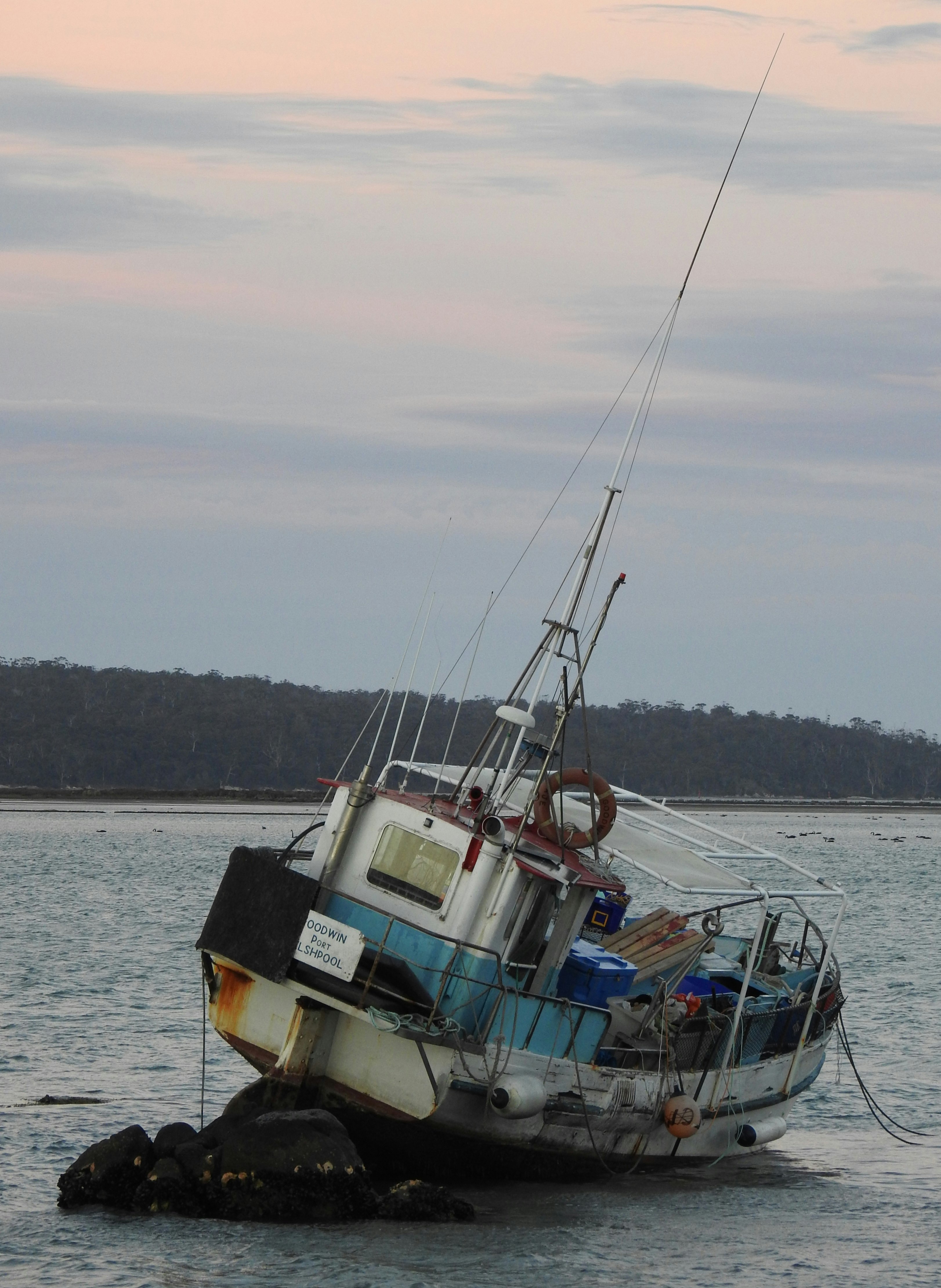 On the Rocks. The clay base of George's Bay couldn't hold the anchor of this fishing boat during a wild storm.
