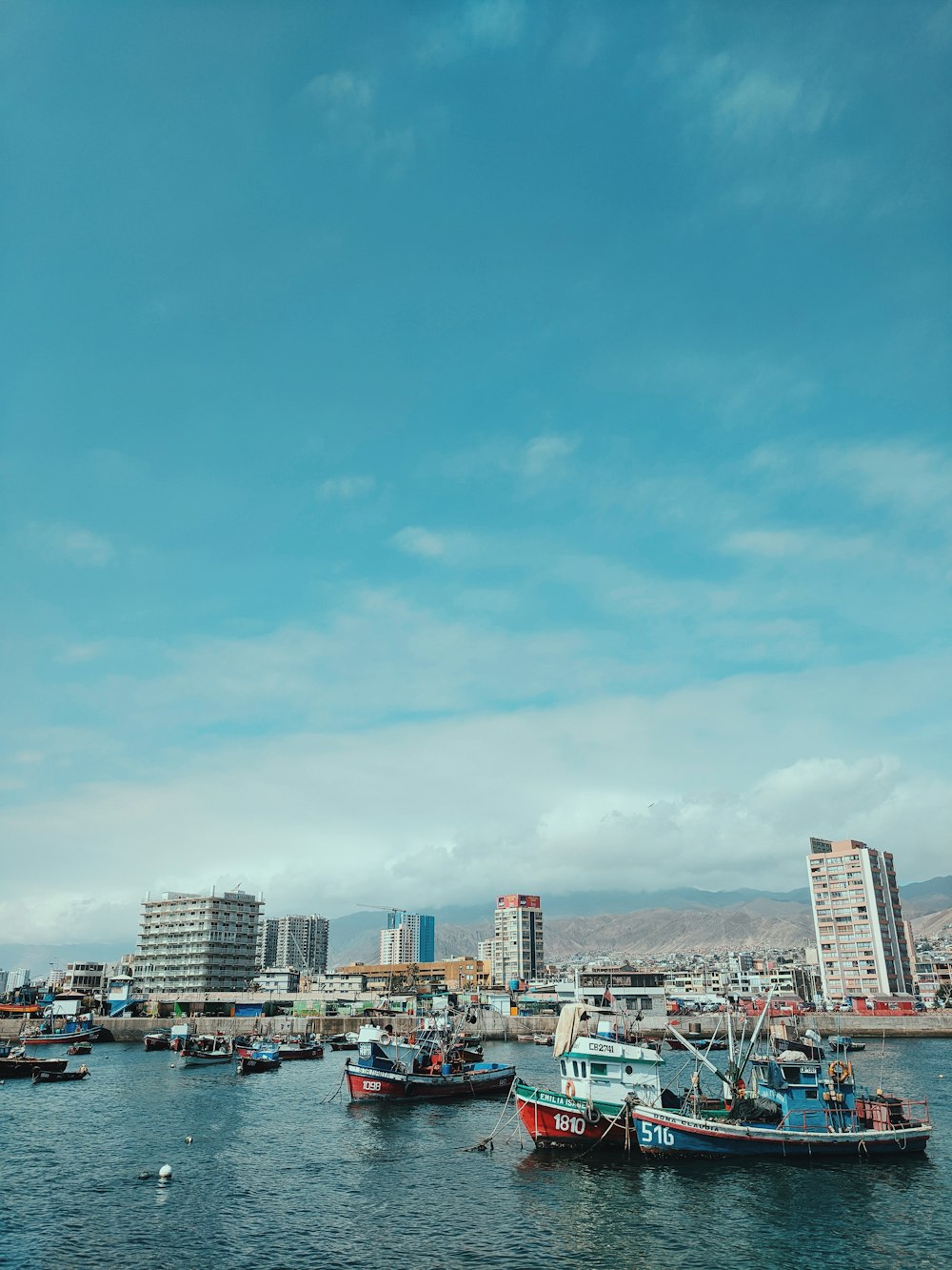 city skyline under blue sky during daytime