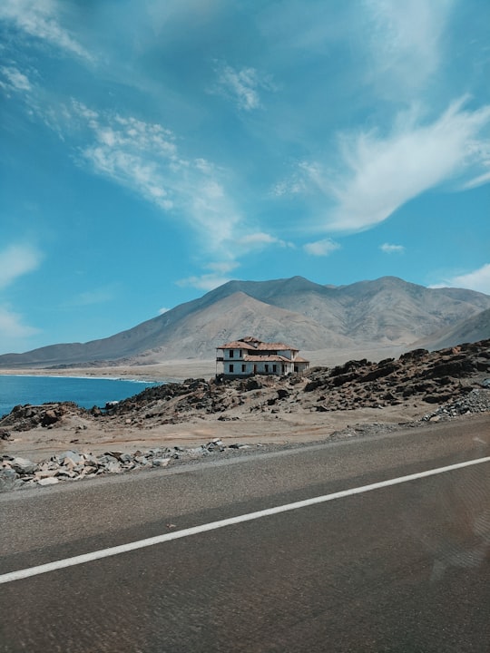 brown and white house near mountain under blue sky during daytime in Antofagasta Chile