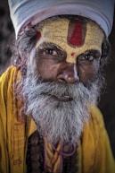man in yellow shirt with white beard
