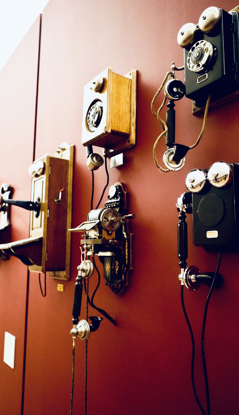 black and white camera on brown wooden wall mounted shelf