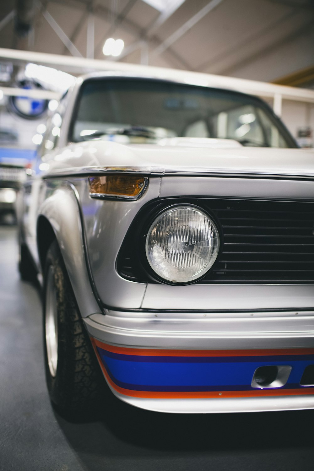 white and blue car in close up photography