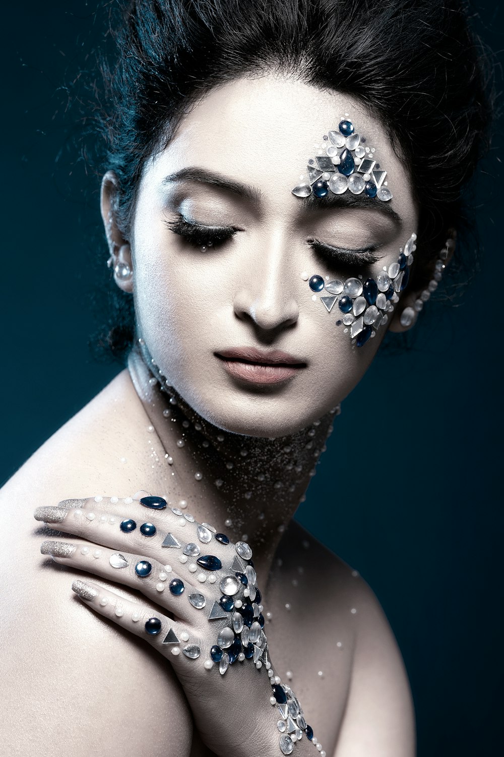 woman with blue and white floral face paint