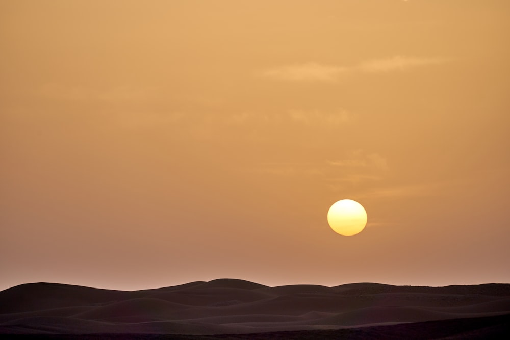 silhouette of mountain during sunset