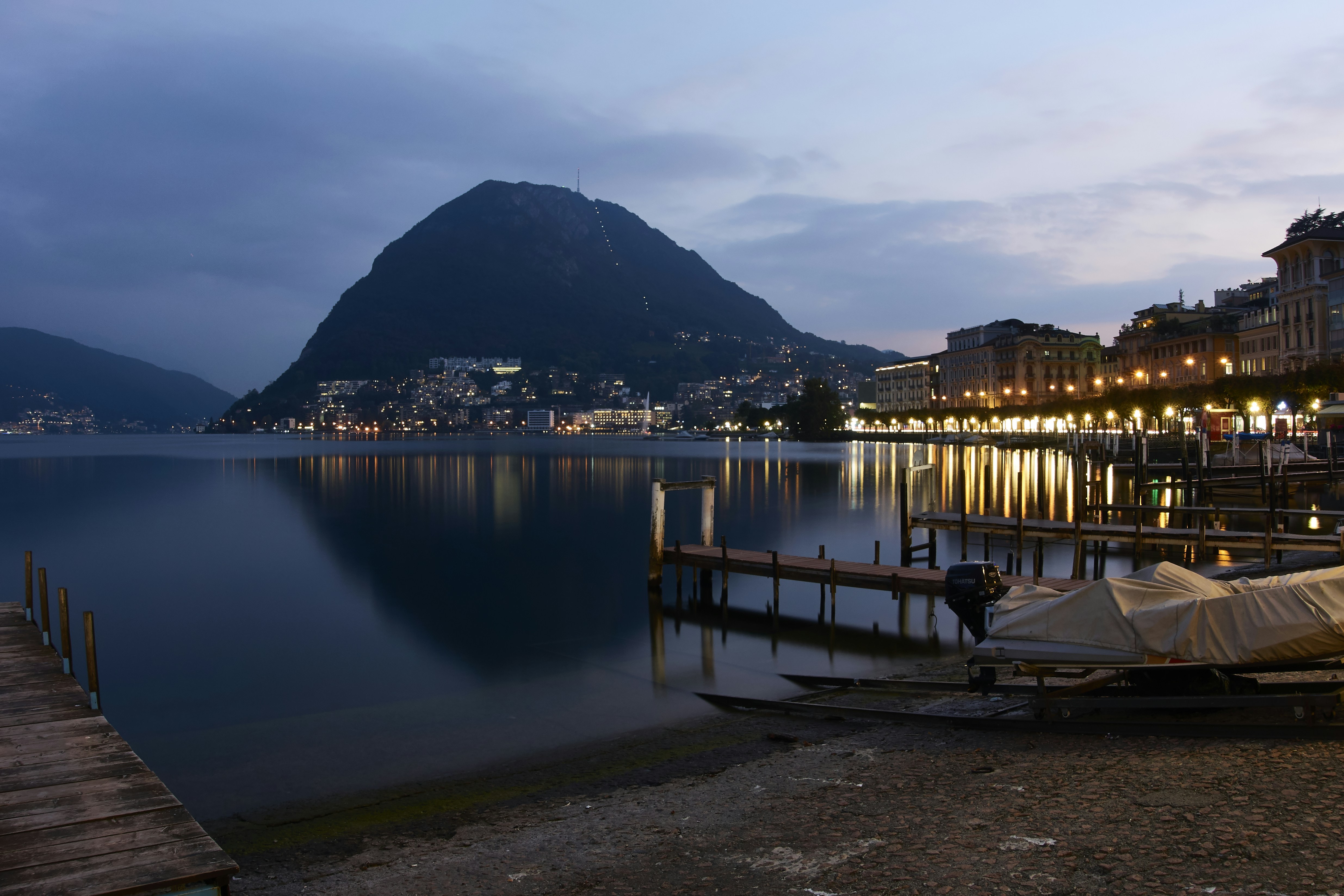 brown wooden dock on lake during daytime