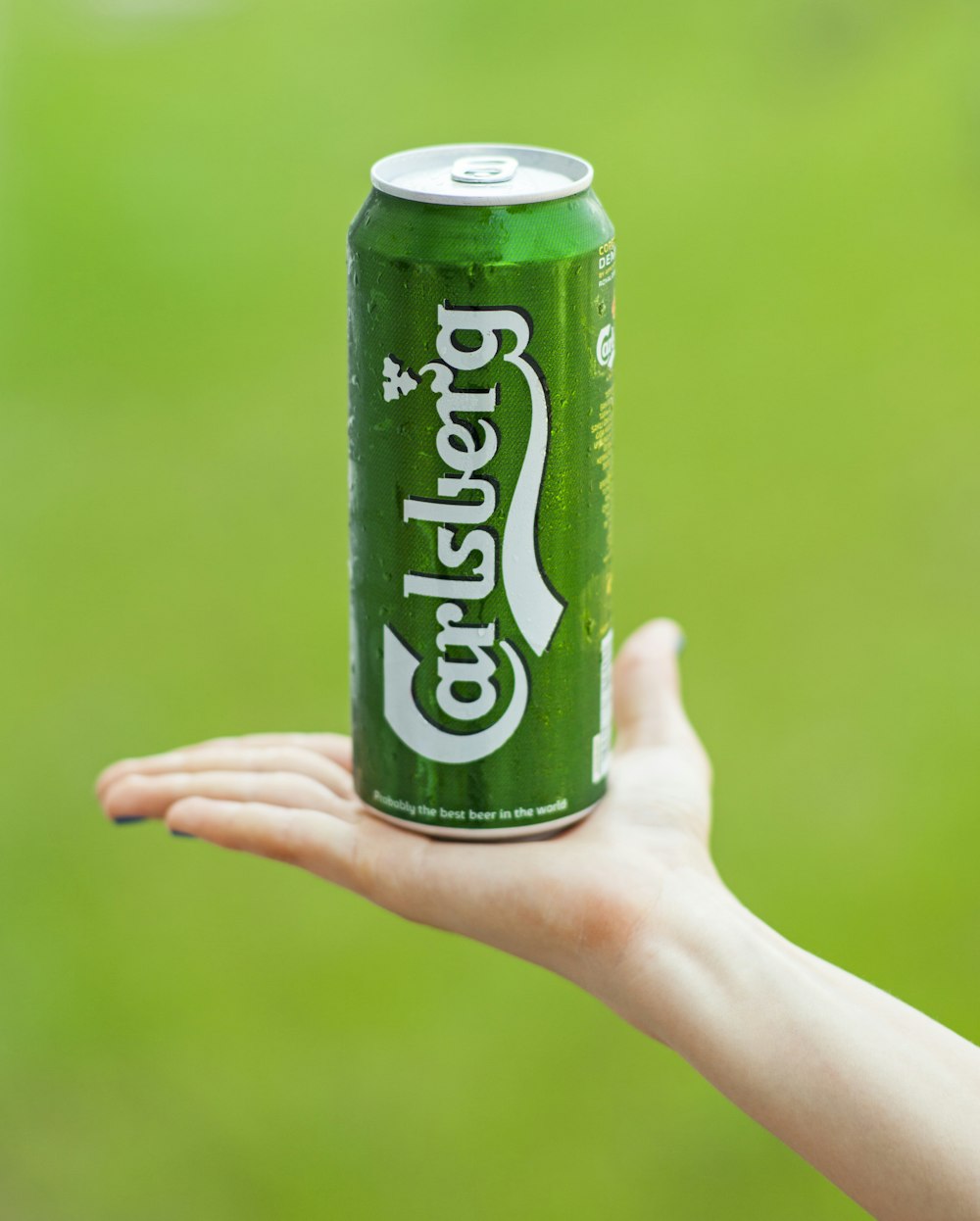 person holding sprite soda can