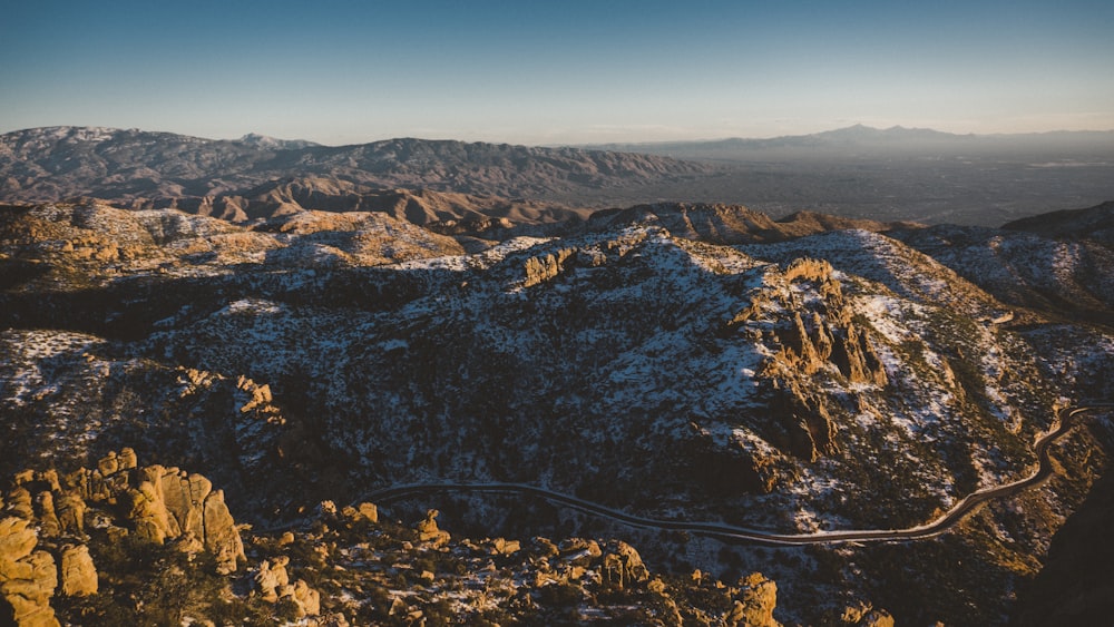 brown and green mountains under blue sky during daytime