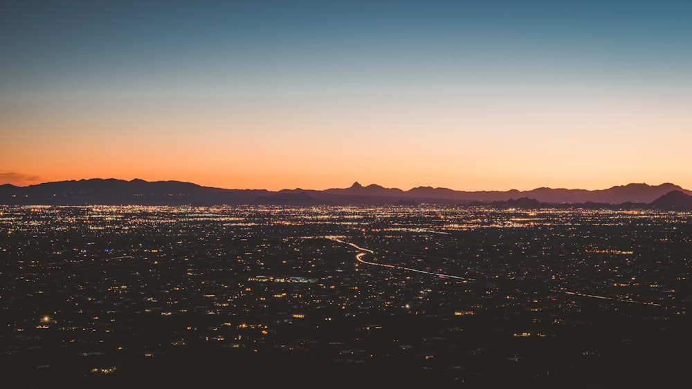 city skyline under blue sky during sunset