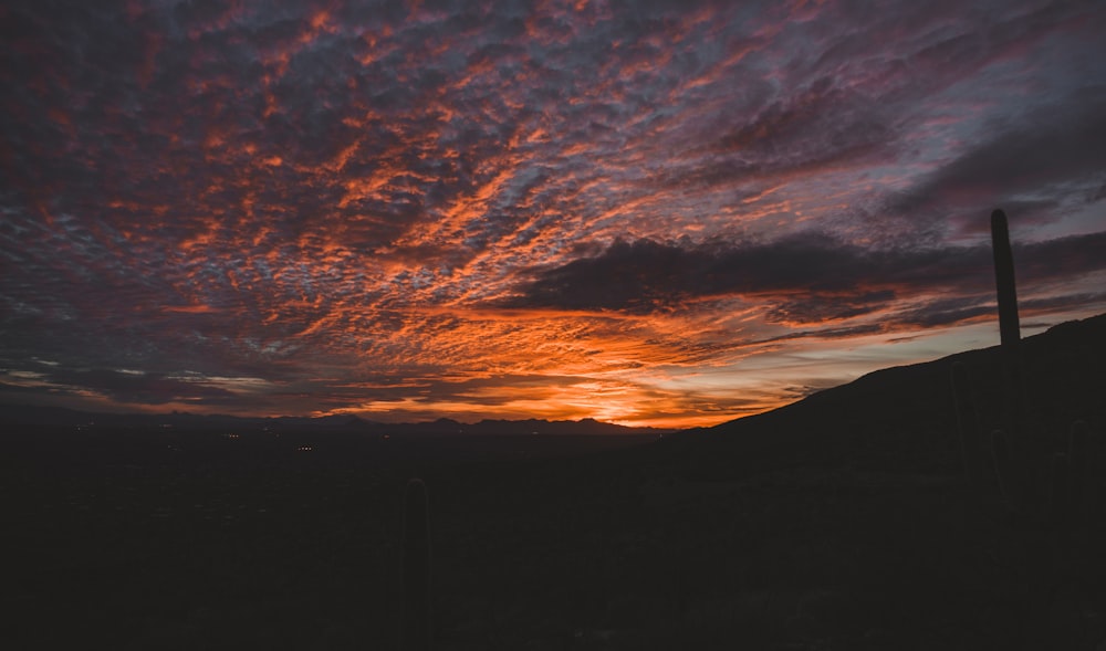 silhouette of mountain during sunset