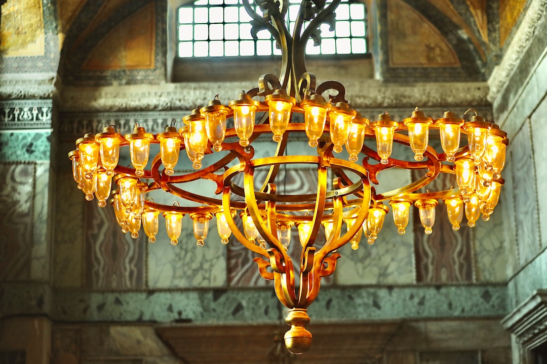 brass and brown pendant lamp