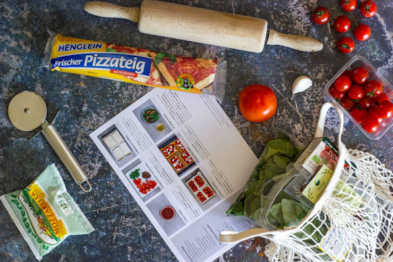 Real food ingredients and meal items arranged with delivery packaging