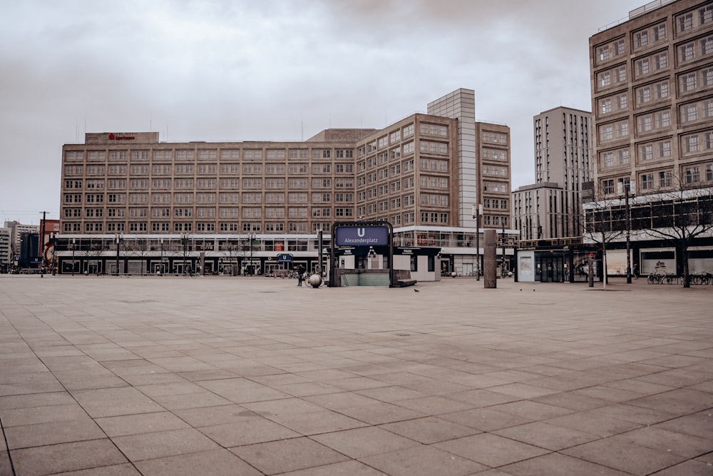 brown concrete building under white clouds during daytime