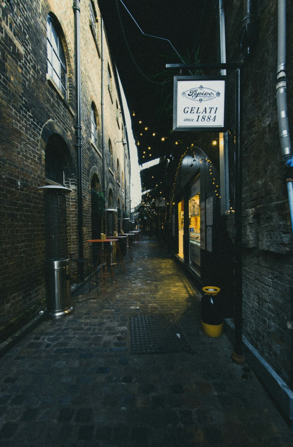 text signage on brown brick wall