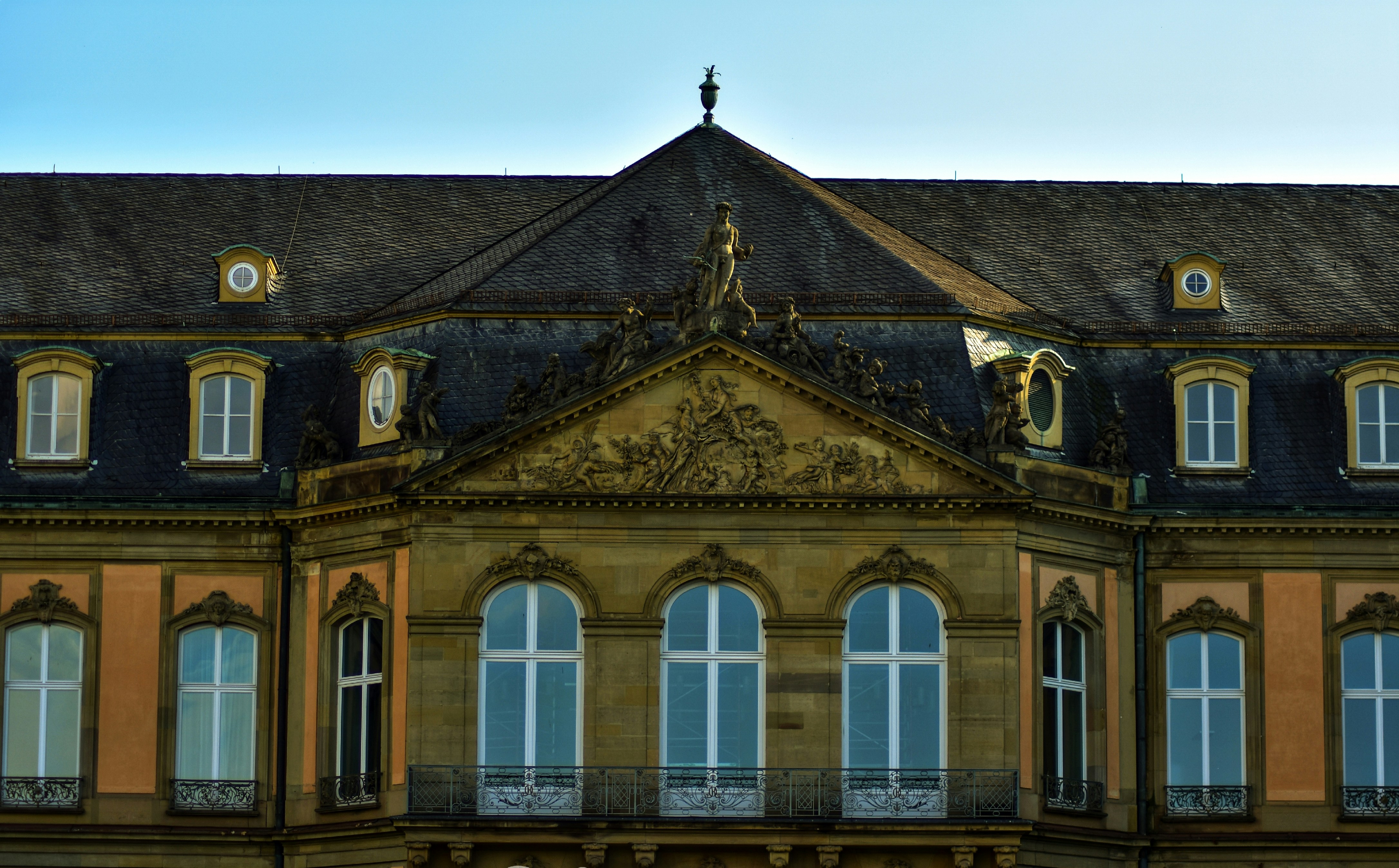brown and white concrete building under blue sky during daytime