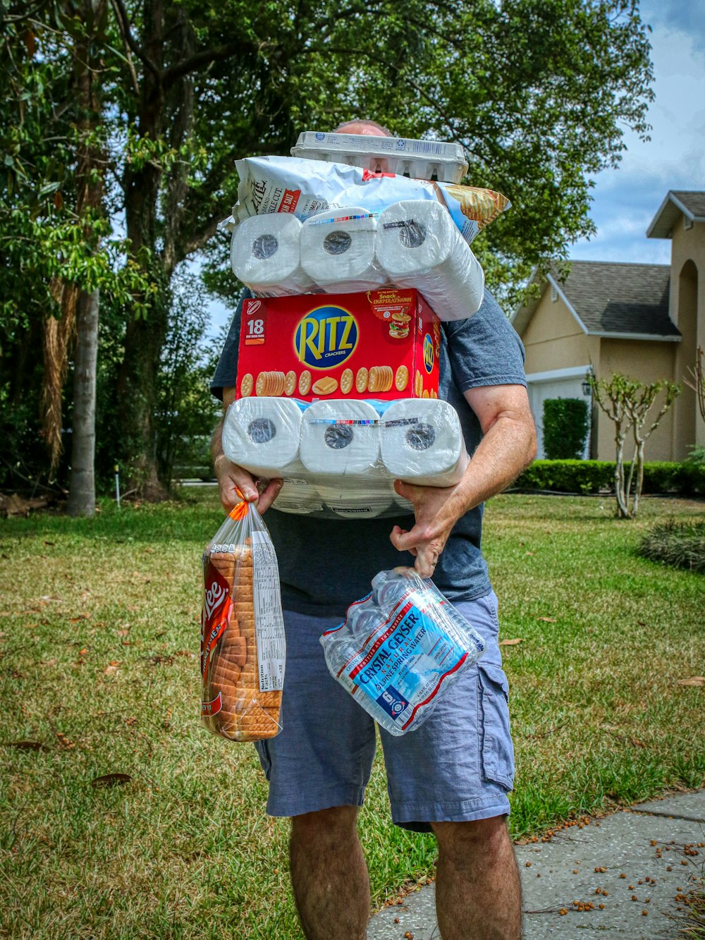 person holding white and red plastic pack