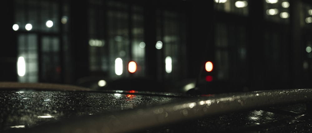 black car on road during night time