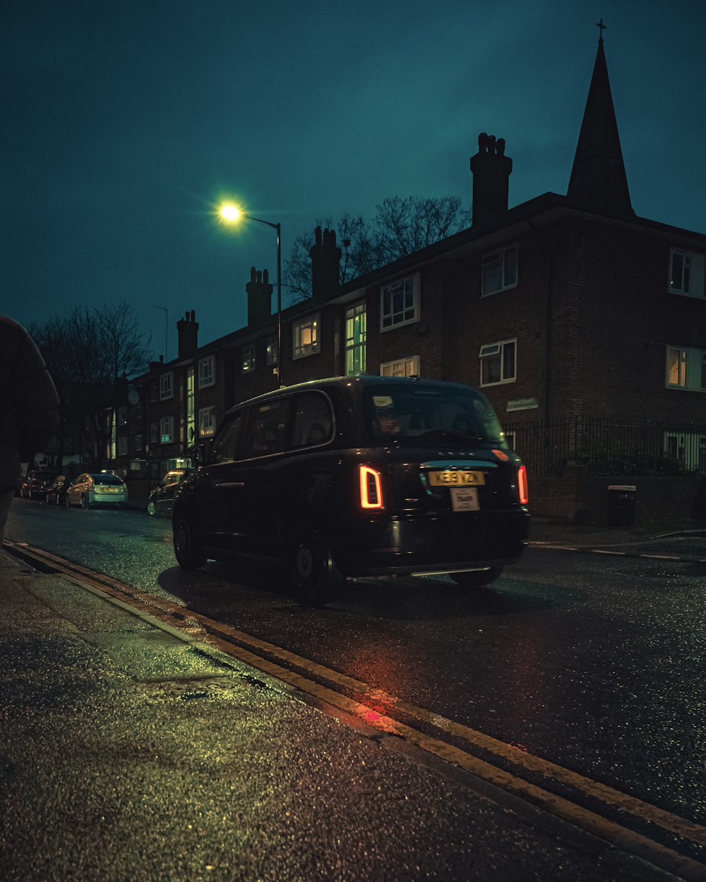 black car on road during night time