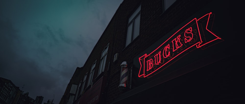 red and white coca cola neon light signage