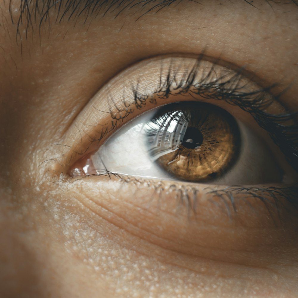 persons eye in close up photography