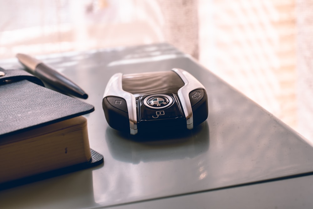 black and silver smartwatch on white table