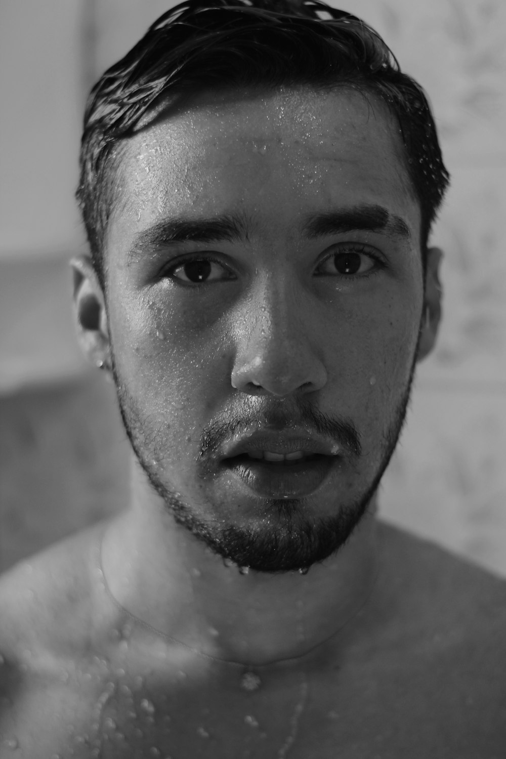 grayscale photo of mans face