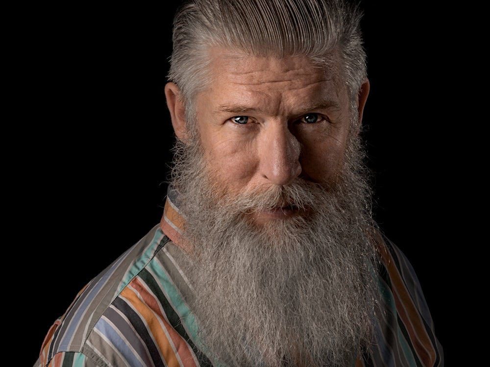 man in white and blue striped shirt