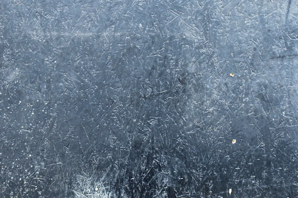 Close-up of the texture and scratch-resistant surface of a premium aluminium metal poster with a gloss finish.