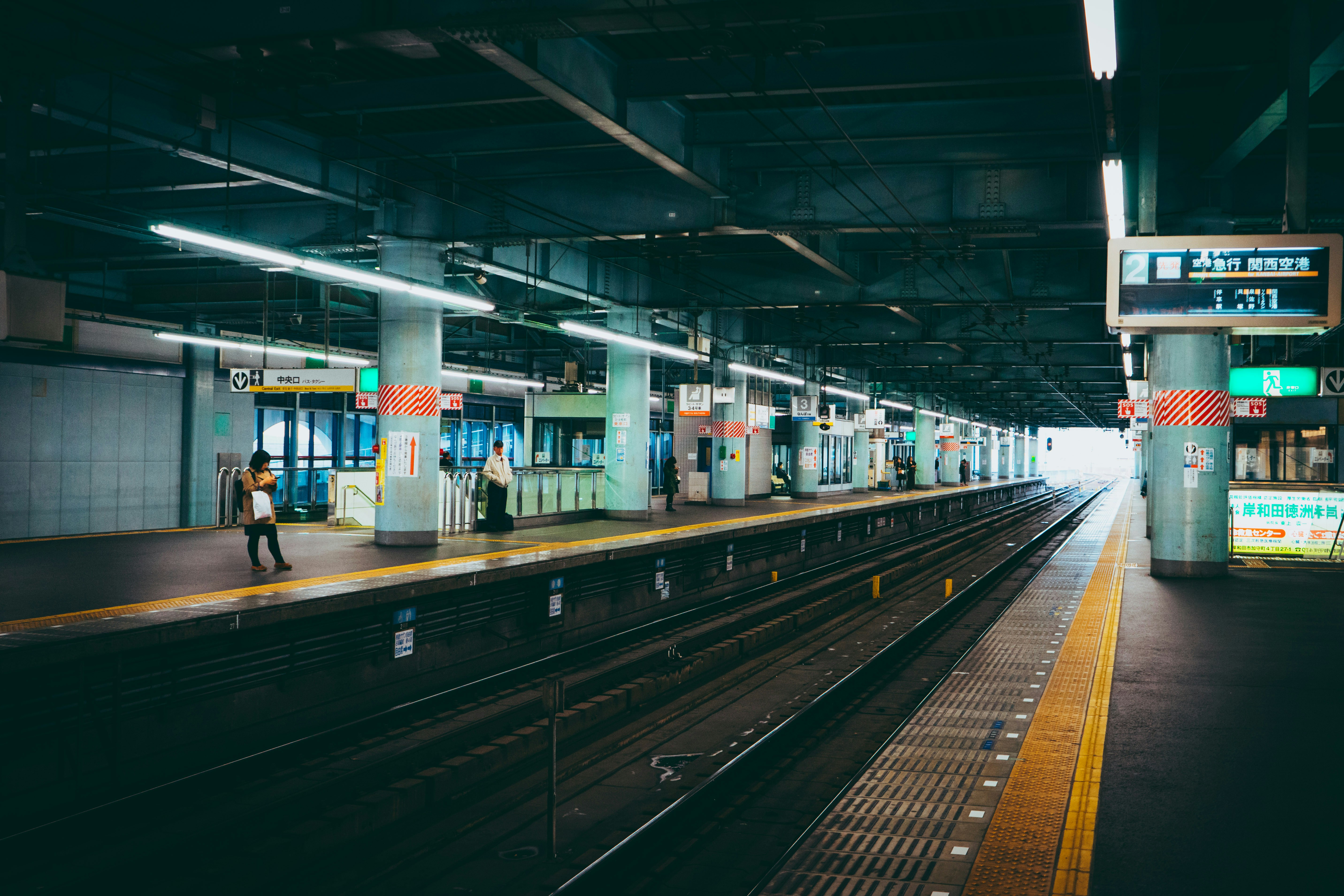 people walking on train station