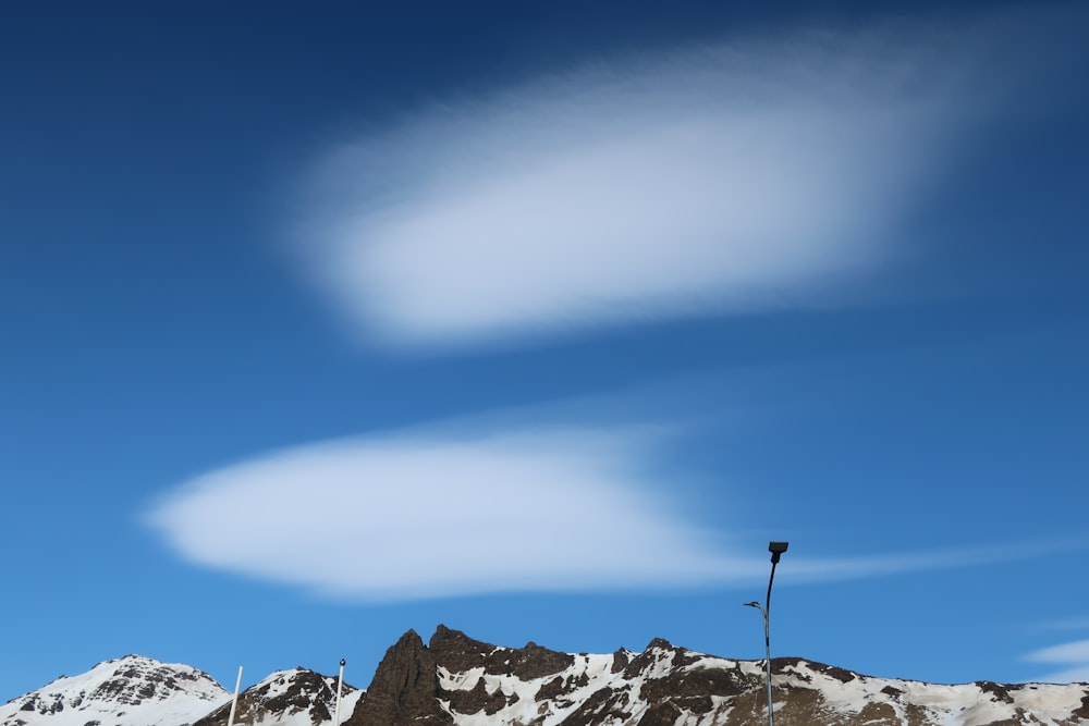 snow covered mountain under blue sky