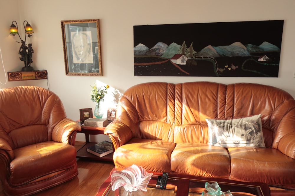 brown leather couch with throw pillows