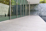 Modern urban art piece blending with travertine textures inside Studio Paolina 2.