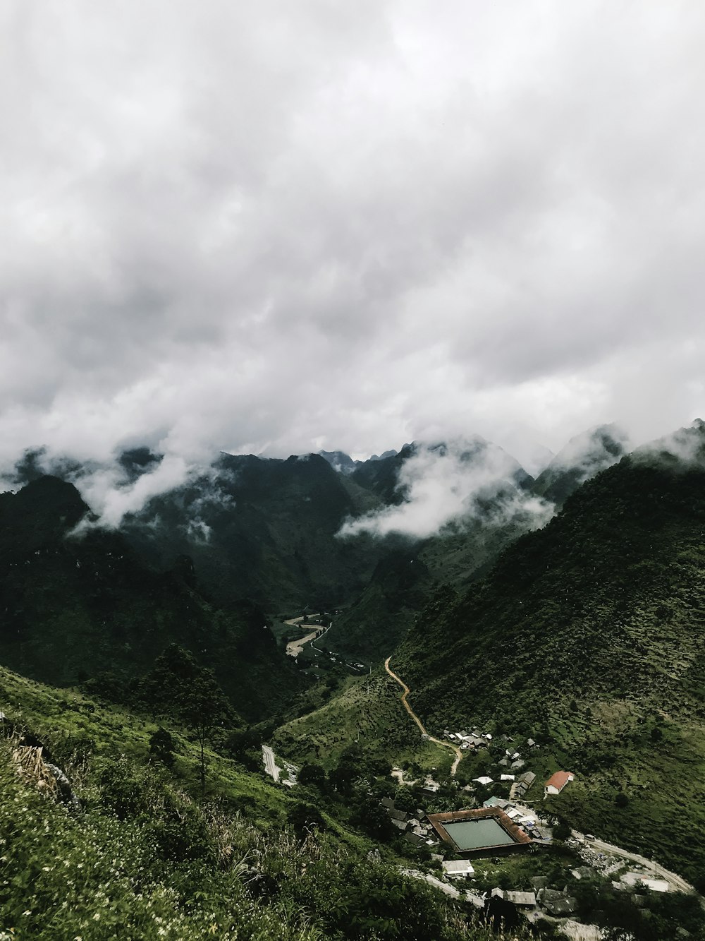 green mountains under white clouds during daytime