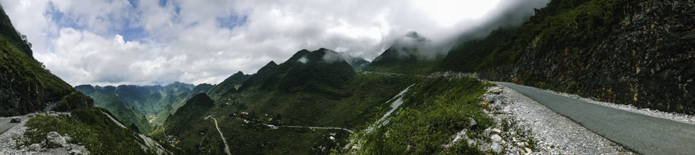 green mountain under white clouds during daytime