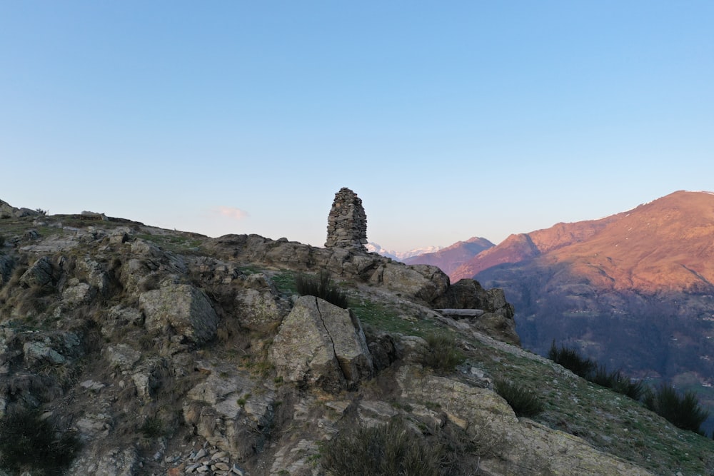 brown rocky mountain under blue sky during daytime