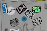 Artistic sticker pack laid out on a clean white surface with local Rochester icons.